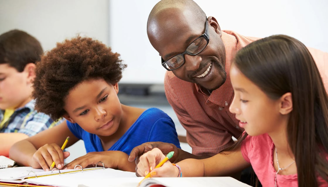 Students engage with a teacher in classroom